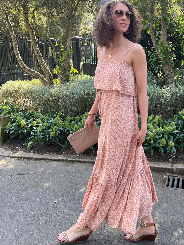 Introducing the Celena dress from Poppy Field The Label in a light brown pink colour. This Maxi dress features a fabric overlay over the chest area, self-tie waist line, floaty maxi skirt & twin spaghetti straps.