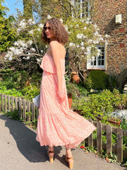 the Celena dress from Poppy Field The Label in a beautiful Coral shade. This Maxi dress features a fabric overlay over the chest area, self-tie waist line, floaty maxi skirt & twin spaghetti straps.