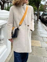 Luxurious Rino and Pelle reversible coat in colour Ivory. This reversible mid-length coat can be worn two ways, one side is a soft faux fur and the other a silky leather.
